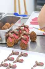 Placement of reindeer shaped chocolate chocolates on a work table, Christmas baking, Haselstaller
