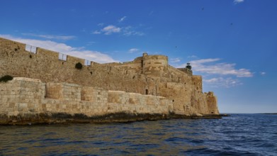 Syracuse, Ortigia island, sea fortress, extensive stone walls of an old fortress on the coast under