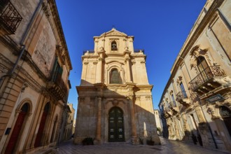 Scigli, beautiful baroque church surrounded by historic buildings in clear weather, Baroque towns