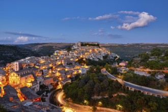 Ragusa, panoramic view of an illuminated city on a hill at night, Baroque towns of Sicily, Baroque