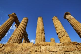 Temple of Hera, Temple of Juno, ancient, well-preserved columns against a bright blue sky, Valley