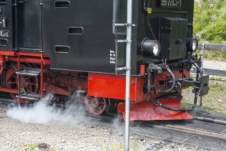Front of a steaming locomotive, steam locomotive, railroad, railroad locomotive, detail, close-up,