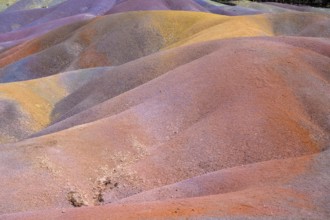 Rolling hills of colored sand form a unique landscape in rainbow colors. Africa, East Africa,