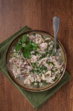 Muzhuzhi, a Georgian dish made from pork legs, with spices and herbs, homemade