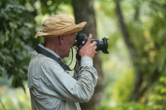Photographer taking pictures, Amani Nature Forest Reserve, Eastern Usambara Mountains, Tanga,