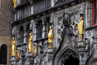 Richly decorated façade and entrance portal with golden figures to the St. Ivo Chapel at the