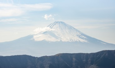 Snow-covered summit of Mount Fuji volcano in spring, Owakudani, Hakone, Japan