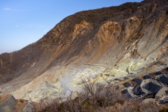 Steaming fumaroles in the Owakudani geothermal area at Komagatake volcano, Hakone, Japan