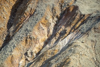 Red and yellow rocks in the Owakudani geothermal area at Komagatake Volcano, Hakone, Japan