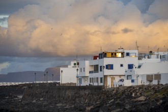Typical white houses in the town of La Santa on the coast, at sunset, Lanzarote, Canary Islands,
