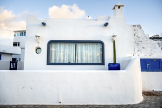 Typical white house with blue windows, La Santa, Lanzarote, Canary Islands, Spain