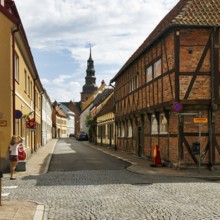 Charming cobblestone street, traditional half-timbered houses and brick buildings, St. Mary's
