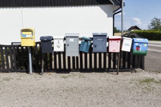Many different mailboxes on a fence, Ystad, Sweden