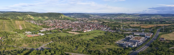 Panoramic view of an urban area with vast hills and blue skies, Korb im Remstal municipality,