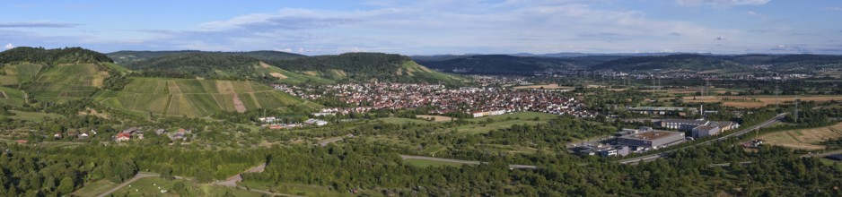 Panoramic view of a city in a hilly landscape with fields and clouds, Korb im Remstal municipality,