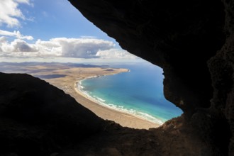 Cueva de las Cabras cave, view from the Risco de Famara cliffs on Famara beach, Playa de Famara