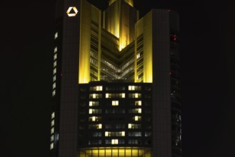 Lights inside the offices project a glowing yellow heart onto the façade of the Commerbank Tower in