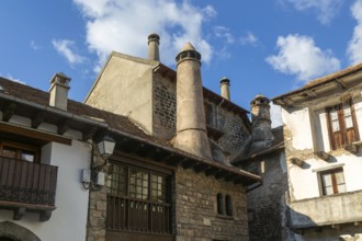 Traditional chimneys medieval village of Echo or Hecho, Valle de Hecho, Pyrenees Mountains, Huesca