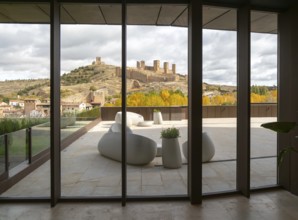 View of castle through glass windows of new Parador de Molina de Aragón, Guadalajara province,