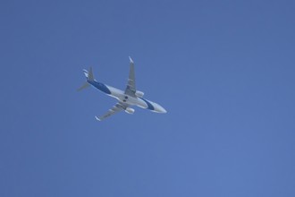 Boeing 737 jet passenger aircraft of El Al Israel airlines flying in a blue sky, England, United