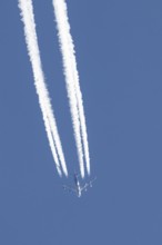 Boeing 747 jumbo jet cargo aircraft of Atlas air airlines flying in a blue sky with contrails or
