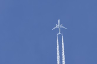 Boeing 787-9 Dreamliner jet passenger aircraft of Gulf Air airlines flying in a blue sky with