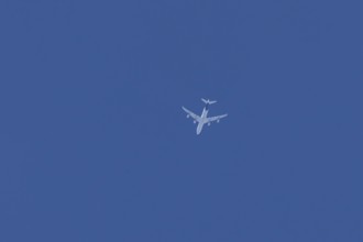 Airbus A340 jet passenger aircraft of Lufthansa airlines flying in a blue sky, England, United