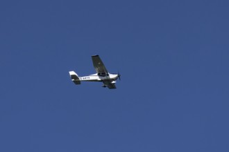 Cessna 172C Skyhawk aircraft flying in a blue sky, England, United Kingdom