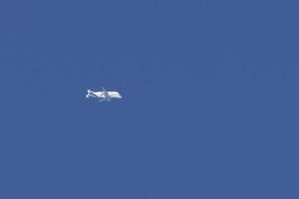 Airbus A330-743L Beluga XL cargo jet aircraft flying in a blue sky, England, United Kingdom