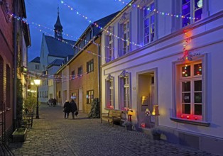 Tastefully decorated Tiefstraße in the evening with St. Peter's Church, Kempen, Lower Rhine, North