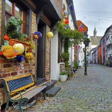 Tiefstraße decorated for Martin's procession with the tower of St. Peter's Church, Kempen, Lower