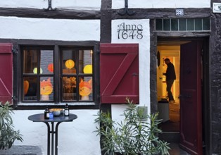 Half-timbered house in the Tiefstraße decorated for the Martin train, Altstadt, Kempen, Lower