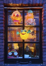 Homemade lanterns for the Martin procession in front of a window in the evening, Old Town, Kempen,