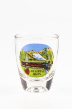 Schnapps glass with decorative Zillertal railway motif, colorful mountains and railroad