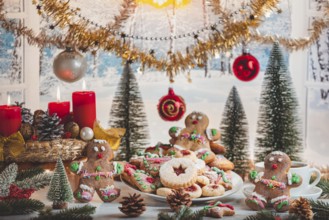 Decorated Christmas table with cookies and festive ornaments