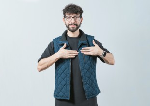 Person gesturing GRATITUDE in sign language. Guy making gesture GRATEFUL in sign language isolated