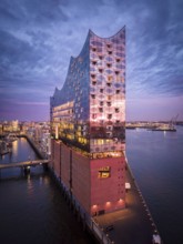 Aerial view of the Elbe Philharmonic Hall with reflections on the façade in evening light above the