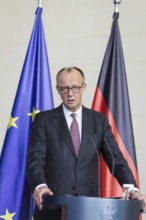 Friedrich Merz (Federal Chancellor of the Federal Republic of Germany, CDU) handing over the annual