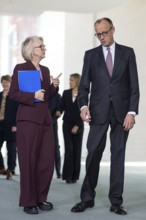 Prof. Dr. Monika Schnitzer (Chair of the Council of Experts) and Friedrich Merz (Federal Chancellor