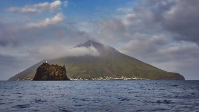 Stromboli island with offshore islet Strombolicchio, volcanic island with picturesque village