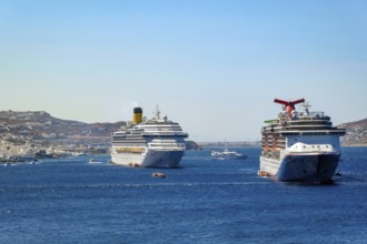 Mykonos, Cyclades, Greece - cruise ships CARNIVAL MIRACLE and COSTA FORTUNA are located in the bay