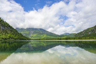Landscape of Lake Offensee after rain when the sun comes through the clouds in spring,