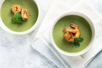 Pea cream soup, with shrimp, green soup, homemade, top view, no people