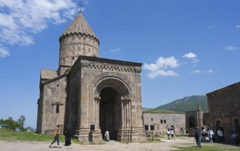 Historic monastery with medieval architecture and impressive tower in scenic surroundings under