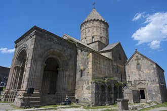 Historic stone church under blue sky, impressive architecture, Surb Pogos-Petros main church, Tatev