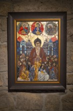 Colorful mosaic painting of religious figures on stone wall, mosaic style icon, Tatev monastery,