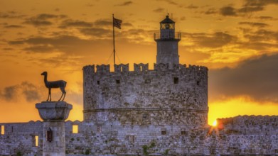 Agios Nikolaos fortress, historic castle with statue in front of a warm sunrise sky, UNESCO World