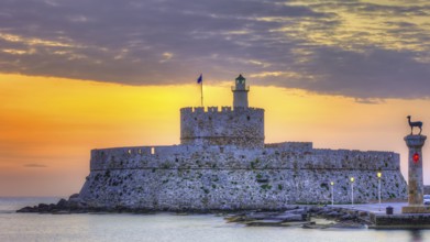 Agios Nikolaos fortress, picturesque castle with lighthouse at sunrise, surrounded by calm sea,