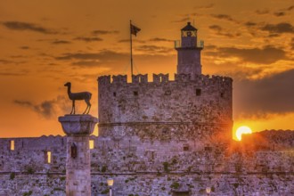Agios Nikolaos fortress, castle and statue at sunrise with emotional and peaceful atmosphere,