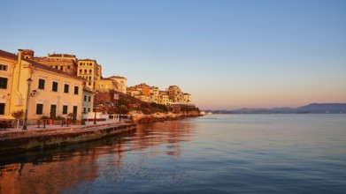 Picturesque coastal town at sunrise with reflection in water, UNESCO World Heritage Site, Old Town